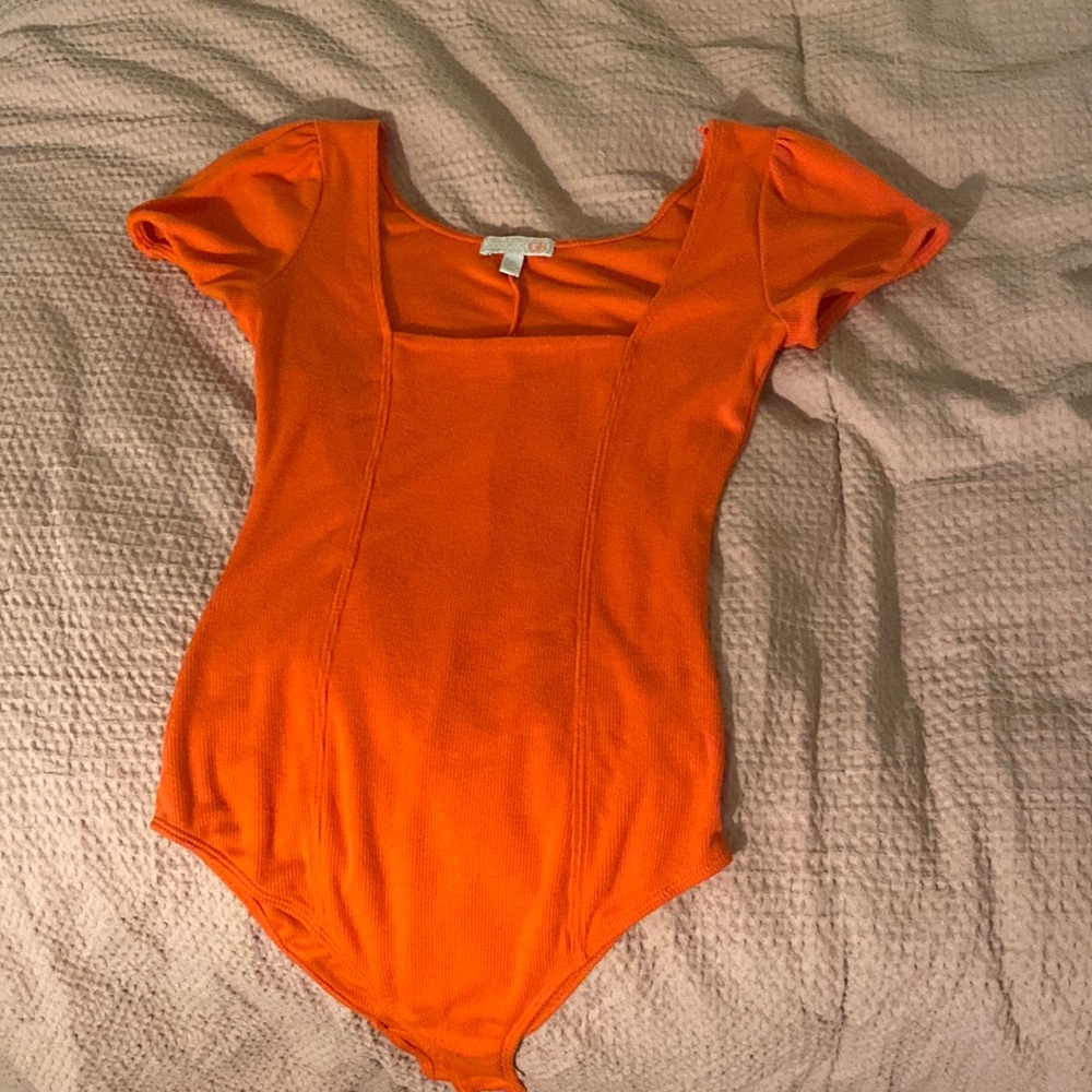 Orange GB body suit.